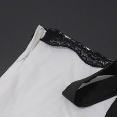 Conjunto de top de tirantes con empalme en blanco y negro y falda escalonada de cintura alta