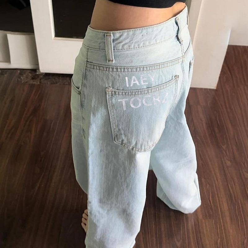 Baggy denim jeans with back pocket lettering and oversized fit for a vintage streetwear look