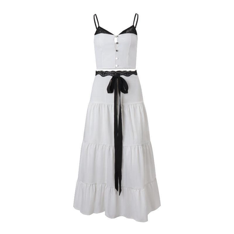 Black and white spliced cami top with a high-waisted tiered skirt, perfect for casual or formal occasions.