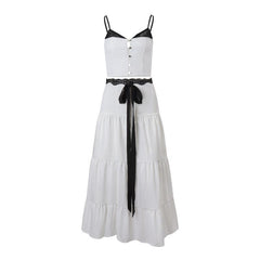 Black and white spliced cami top with a high-waisted tiered skirt, perfect for casual or formal occasions.