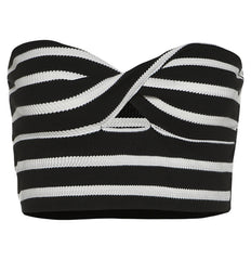 Black and white striped crisscross bandeau top with cutout detail, styled for a modern, chic look.

