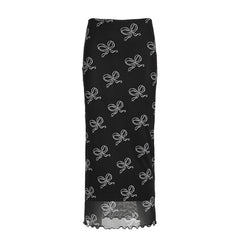 Black midi skirt with white bow print and a semi-sheer hem, perfect for chic and elegant styling.