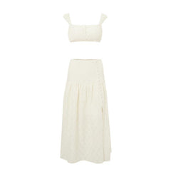 White eyelet embroidered two-piece set featuring a cropped top and a high-waist skirt with a side slit.