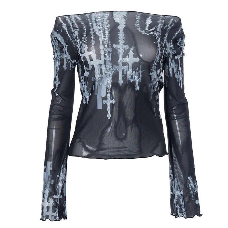 Sheer black mesh top with cross print and long sleeves, styled with edgy accessories for a gothic-inspired look.