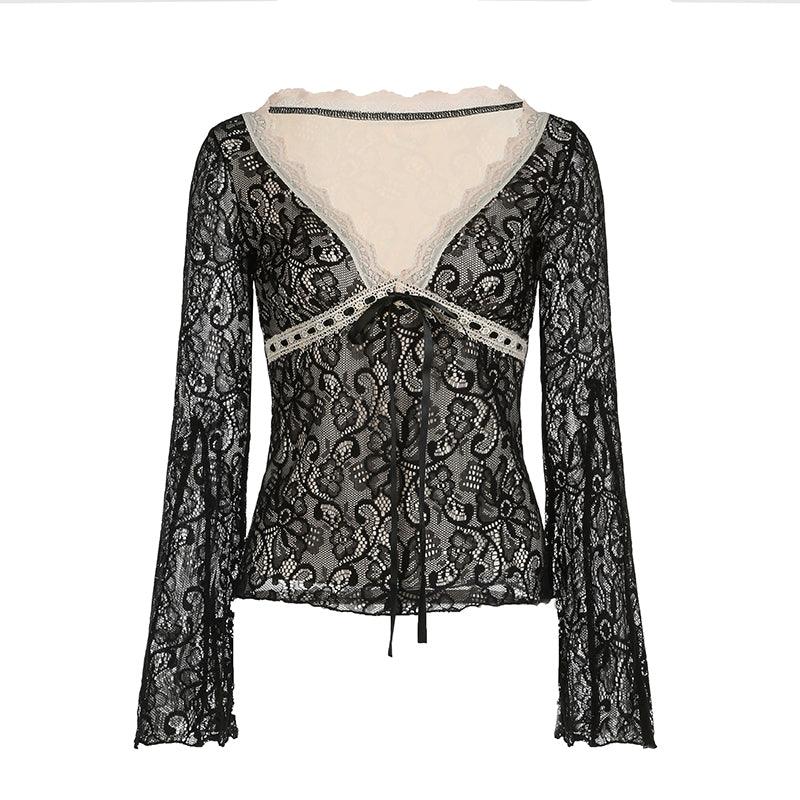 An elegant lace top featuring a vintage tie-front design and wide bell sleeves, blending romance with stylish flair.