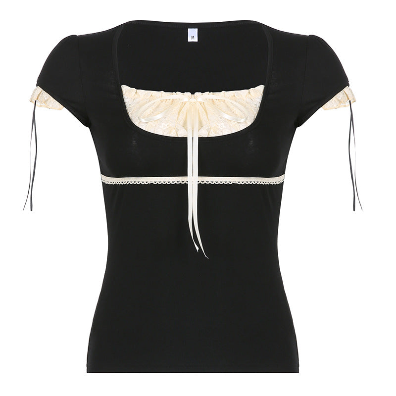 Black puff sleeve top with cream lace trim and ribbon tie accents, styled with a denim skirt for a vintage-inspired look.