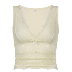 Lace V-neck ruched cami top with delicate lace trim and bow accent.