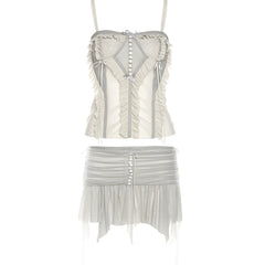 Sheer two-piece set with a ruffled camisole and flowy mini skirt, featuring pearl-like buttons and delicate trims for a romantic, airy look.