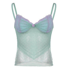 Mint green sheer camisole with lilac lace details and a rose accent, paired with casual denim for a chic and feminine style.