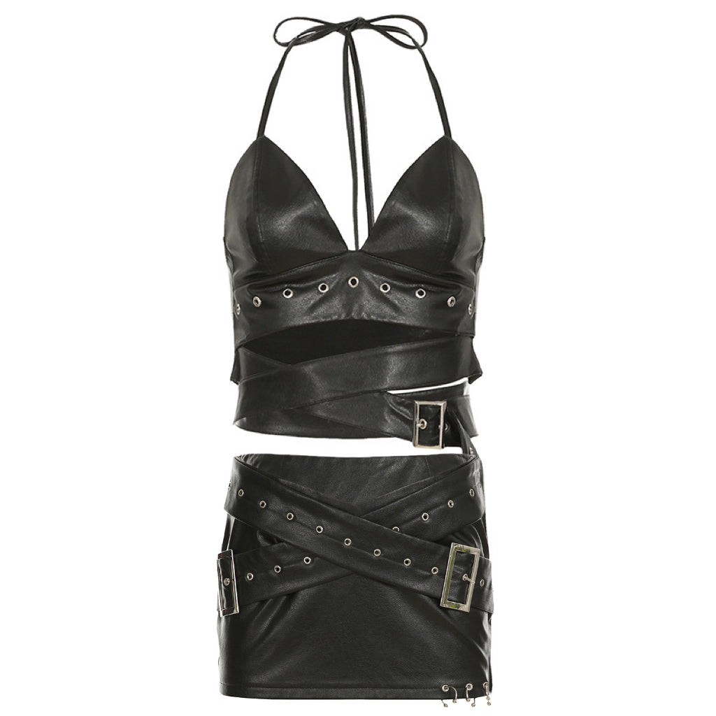 Two-piece faux leather set featuring a halter crop top and mini skirt with buckle and strap details, perfect for bold statement looks.